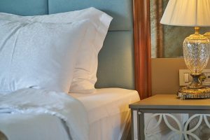 luggage away from the bed